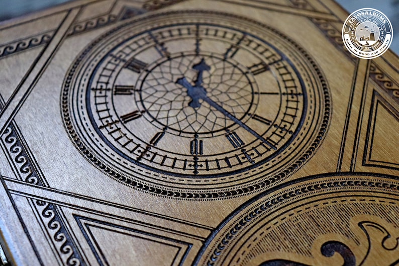 May include: A wooden box with a clock face design. The clock face has Roman numerals and a detailed design. The box is made of dark wood and has a decorative pattern.
