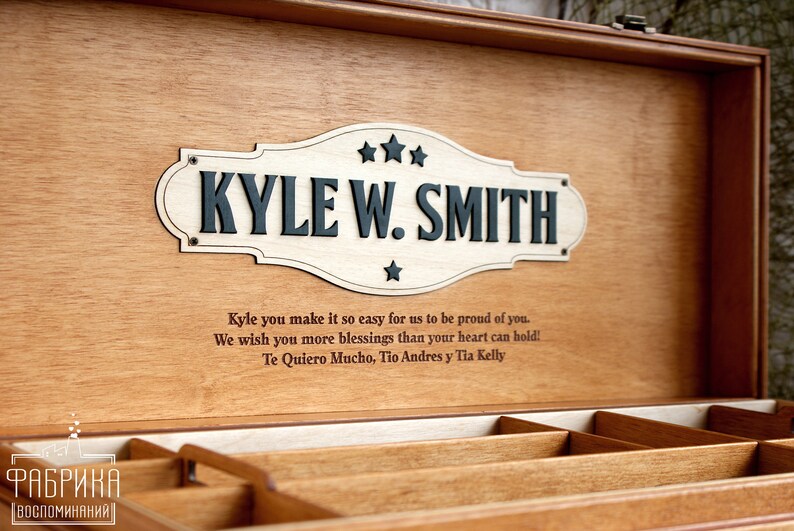 May include: A wooden keepsake box with a personalised engraved plaque that reads "KYLE W. SMITH". The box has a message inscribed on the lid: "Kyle you make it so easy for us to be proud of you. We wish you more blessings than your heart can hold! Te Quiero Mucho, Tio Andres y Tia Kelly".