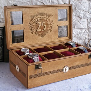 May include: A wooden watch box with a glass top and eight compartments lined with red velvet. The lid is engraved with the text "Happy Birthday Dear Brother 25".