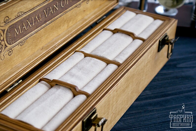 May include: A wooden box with a hinged lid and a velvet interior. The box has a personalized inscription that reads "Maxim Van Off".