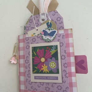 Small flip journal with embellishments and lots of pockets, etc.