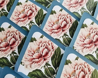 May include: A stack of square cards with a blue border and a white background. Each card features a pink peony flower with green leaves.