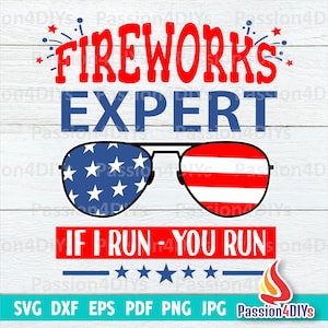 May include: A patriotic design featuring the text "FIREWORKS EXPERT" in red and blue. The design includes sunglasses with American flag patterns and the phrase "IF I RUN - YOU RUN". The image is on a white wood-grain background.