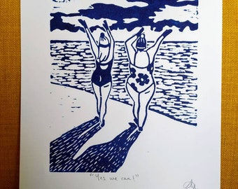 Original lino print featuring cold water sea swimmers on Worthing beach. Yes we can!