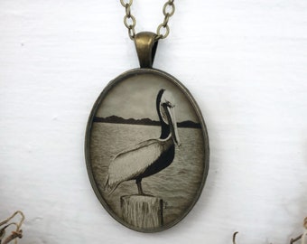 Pelican Necklace, Pelican Bird Jewelry, Ocean Aesthetic, Nautical Gift for Sailor, Bird on the Pier, Antique Bronze Cameo  Art Pendant