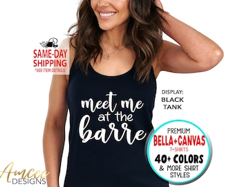 May include: A black tank top with the text "meet me at the barre" in white. The tank top is displayed on a model. The text "DISPLAY: BLACK TANK" is visible in the image. The text "PREMIUM BELLA+CANVAS T-SHIRTS 40+ COLORS & MORE SHIRT STYLES" is visible in a circle.