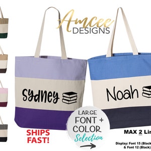 May include: Two personalized tote bags with the names "Sydney" and "Noah" printed in black on a white background. The bags are made of canvas and have a blue, purple, and beige striped design. The text "LARGE FONT + COLOR Selection" is printed on a white circle with a black arrow pointing to the right.
