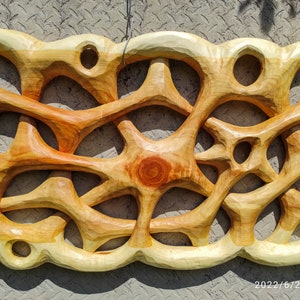 Abstract wall panel, hand carved decoration.