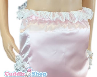 May include: Pink satin diaper with white lace trim. The diaper has a ruffled edge and is made of a soft, silky material. The text "CuddLz Shop" is printed on the diaper.