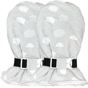May include: Two gray baby mittens with a white cloud and rain pattern. Each mitten has a black strap with a white buckle. The mittens are designed to stay on the baby's hands.