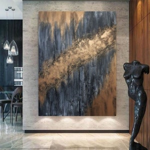 May include: Abstract painting with a gold and blue color scheme. The painting has a textured surface and a modern style.