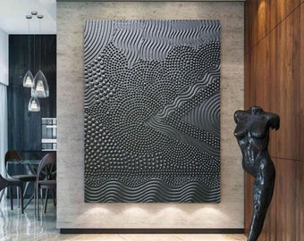 May include: A large rectangular wall art piece featuring a monochromatic black surface with a highly textured, raised relief design. The composition consists of intricate patterns including dense clusters of small dots and rhythmic wavy lines.