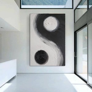 May include: Abstract painting of a yin yang symbol in black and white. The symbol is painted on a canvas and has a textured surface.