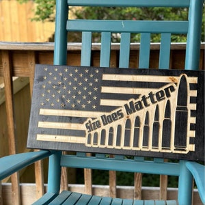 Engraved wooden flags and signs. Pick you design. All are finished with picture hanging hardware. Can be custom made.