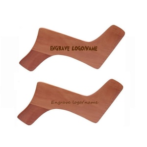 May include: Two wooden beard shaping tools with the text "ENGRAVE LOGO/NAME" and "Engrave logo/name" on them.
