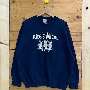 May include: A navy blue sweatshirt with a white graphic of three mice wearing sunglasses and the text "Rice's Mice" on the front.