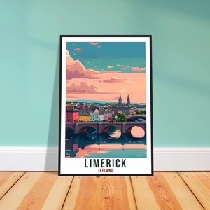 May include: A framed art print of Limerick, Ireland, featuring a colorful cityscape with a bridge over a river. The sky is filled with pink and orange clouds. The print has the text "LIMERICK IRELAND" at the bottom.