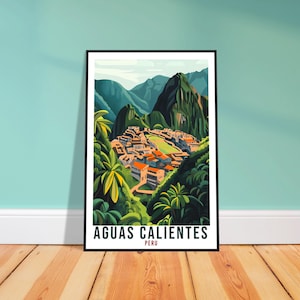 May include: A framed art print showing a stylized illustration of Aguas Calientes, Peru. The artwork depicts a village in a valley surrounded by green mountains and lush vegetation. The print has a black frame and the text "AGUAS CALIENTES PERU" at the bottom.