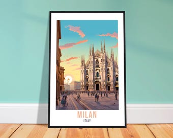 May include: Framed art print featuring a vibrant illustration of the Milan Cathedral in Italy. The artwork depicts the cathedral at sunset, with a bustling plaza and the text "MILAN ITALY" at the bottom. The frame is black.