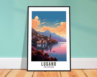 May include: A framed art print featuring a scenic view of Lugano, Switzerland. The artwork depicts a lakeside town with buildings, mountains, and a vibrant sky with pink and orange clouds. The print includes the text "LUGANO SWITZERLAND".