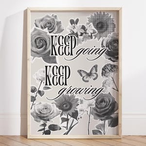 May include: Monochrome framed print with floral illustrations and the text "Keep going, Keep growing." The design incorporates roses, sunflowers, and a butterfly. The frame is a light wood colour.