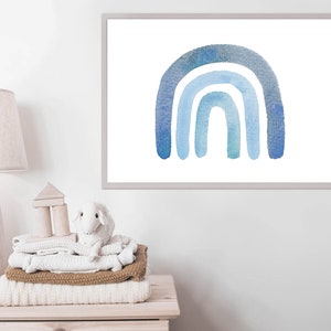 May include: A watercolor painting of a blue rainbow with four arches. The rainbow is painted on a white background and framed in a simple gray frame.