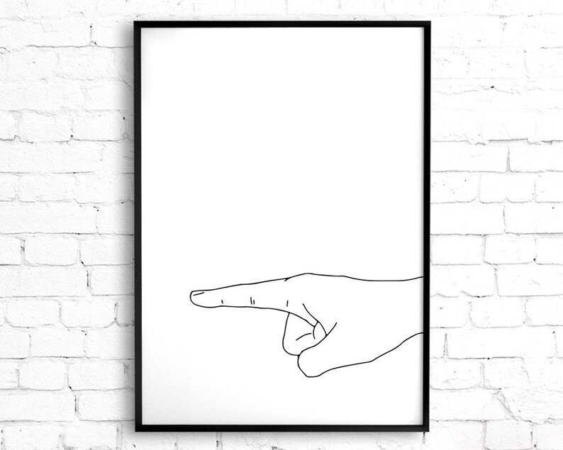 May include: Black framed art print featuring a minimalist line drawing of a hand pointing to the right. The artwork is set against a white background, with the hand's outline in black.