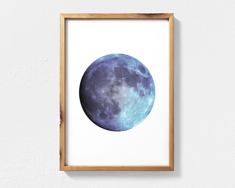 May include: A framed print of a blue and purple moon with a white background.