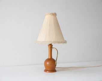 Table lamp made of teak and brass with a pleated textile shade, Sweden 1950s