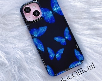 May include: A black phone case with a blue butterfly pattern. The case has a camera cutout and a SookieOfficial logo.