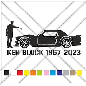 May include: Black and white silhouette of a person standing next to a car. The car is a classic muscle car with a long bonnet and a rounded roof. The text "KEN BLOCK 1967-2023" is printed below the car.