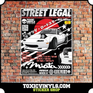 May include: A black and white sticker featuring a white Mazda Miata roadster with the text "STREET LEGAL" and "MX5 Edition" in red and white. The sticker also includes the text "TOXIC VINYLS" and "ステッカーショップ" in Japanese.