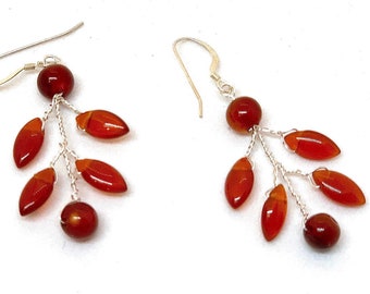 Orange earrings woven with silver wires and small Carnelian gemstone beads