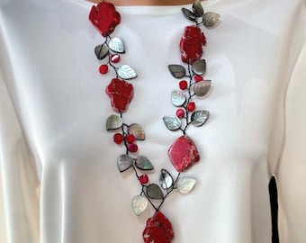 Red statement necklace woven to a vine with large gemstone, red coral beads and Abalone shell leaves.