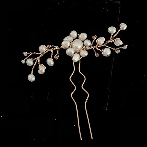 Costume hair jewelry of a vine hand shops crafted with 14k gold filed, natural pearls and Swarovski crystals.