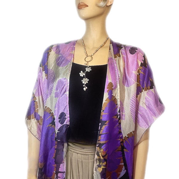 Spring ensemble for women, featuring an open silk kimono and a pearl necklace adorned with crystals in a floral motif design.