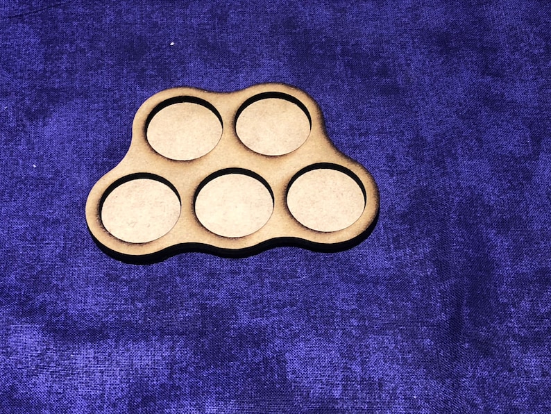 May include: A wooden tray with six circular cutouts, perfect for holding small items like paint pots or dice. The tray is brown and has a slightly irregular shape.