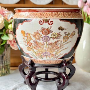 May include: A set of three ceramic mugs with a speckled, matte finish. The mugs are in shades of cream, light gray, and dark gray. Each mug has a simple, minimalist design and a rounded handle.