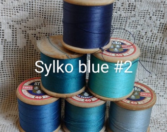 Six wooden reels of vintage Sylko thread, Sylko Blue #2