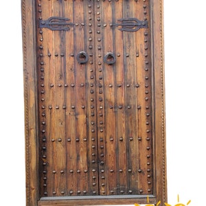 Vintage moroccan double exterior  interior door handmade with moorish metal knocker and umberella nail heads