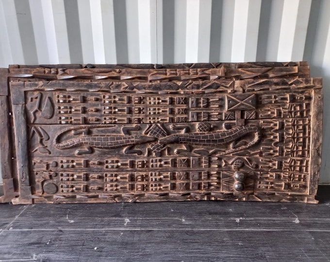 Antique african dogon door  one of a kind old wooden panel great for wall decor african art featuring tribe warriors pride