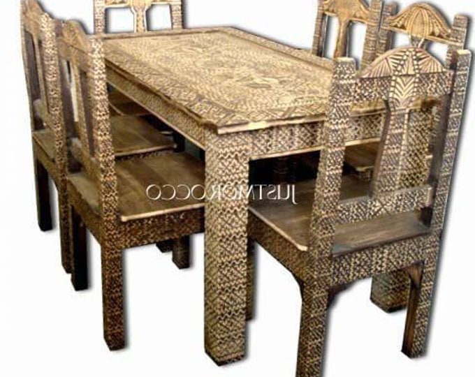 One of a kind vintage carved cedar touareg nomad African dining room set with a table and six chairs moroccan furniture