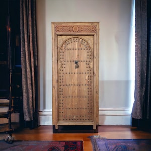 Vintage moroccan door handmade with metal knocker and umberella nail heads