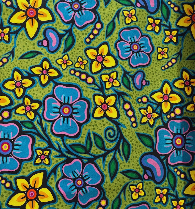 May include: A vibrant floral pattern featuring large blue and yellow flowers with pink and orange centers, set against a green dotted background. The design includes black stems and green leaves, creating a bold, colorful textile design.