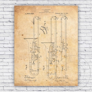 May include: A vintage patent drawing for a trombone, showing a detailed illustration of the instrument's design. The patent number 1,059,043 is visible at the top of the drawing, along with the inventor's name, J.L. De Good, and the date of the patent, April 15, 1918.