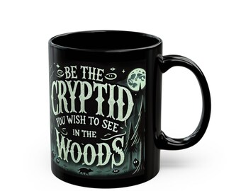 Be the Cryptid You Wish to See in the Woods - Black Ceramic Coffee Mug - Cryptid Lover Gift