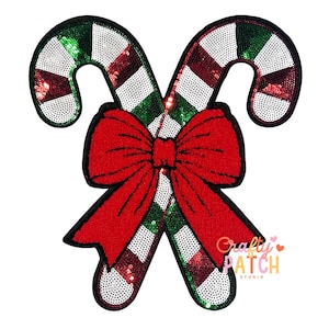 May include: A sequined Christmas patch featuring two candy canes with red and white stripes, green and white stripes, and a large red bow. The patch has a black border and a logo that says "Crafty Patch Studio".