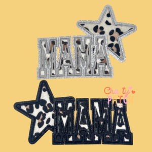 May include: Two patches with the word "MAMA" in a varsity style font. One patch is silver with a leopard print star, the other is black with a leopard print star. The background is yellow.