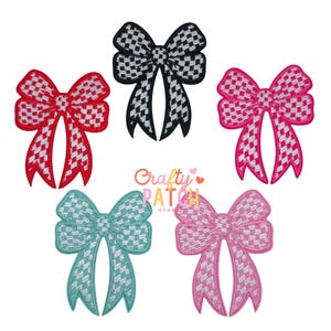 May include: Five embroidered bow appliques in red, black, pink, teal, and light pink. Each bow features a checkered pattern and white stitching. The bows are arranged on a white background. The text "Crafty Patch Studio" is also visible.