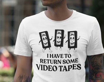 I Have to Return some Videotapes - Kurzarm Unisex T-Shirt - American Psycho Inspiriert Retro Horror Vintage Horror Geschenk Tee VHS Verleih